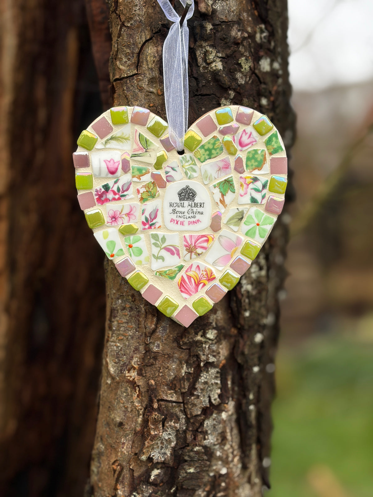 Handcrafted mosaic heart using Royal Albert Pixie Pink bone china with lime green and dusky pink tile border and organza ribbon